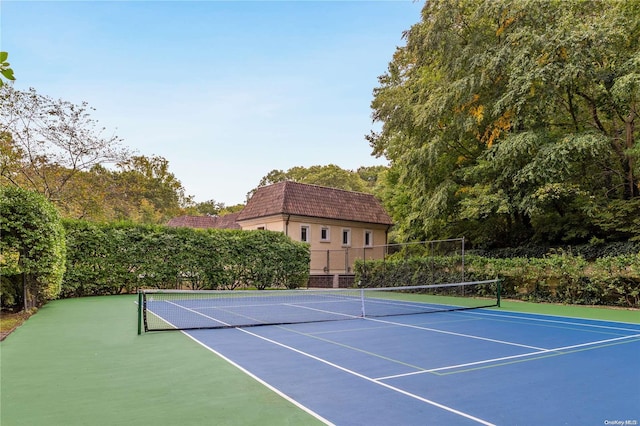 view of tennis court featuring basketball court