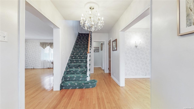 interior space featuring hardwood / wood-style flooring and a notable chandelier