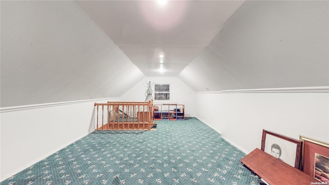 additional living space featuring lofted ceiling and carpet floors