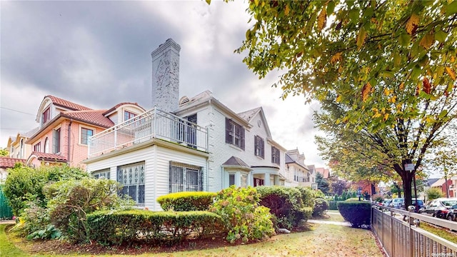 view of home's exterior featuring a balcony