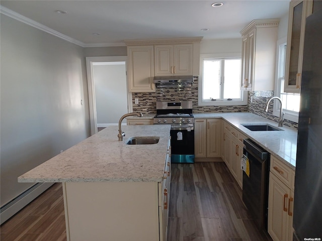 kitchen with sink, a kitchen island, dark wood-type flooring, and appliances with stainless steel finishes