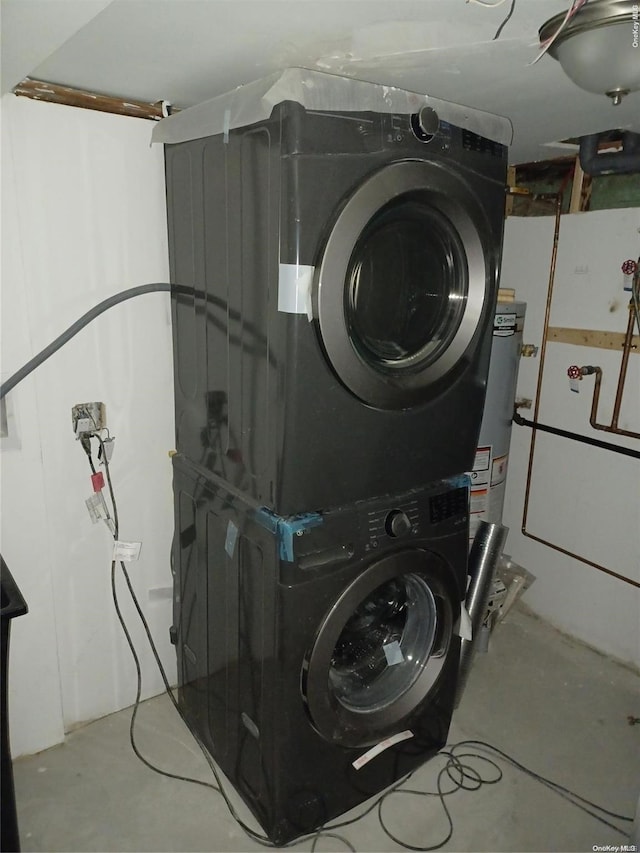 laundry room with stacked washer / dryer and water heater