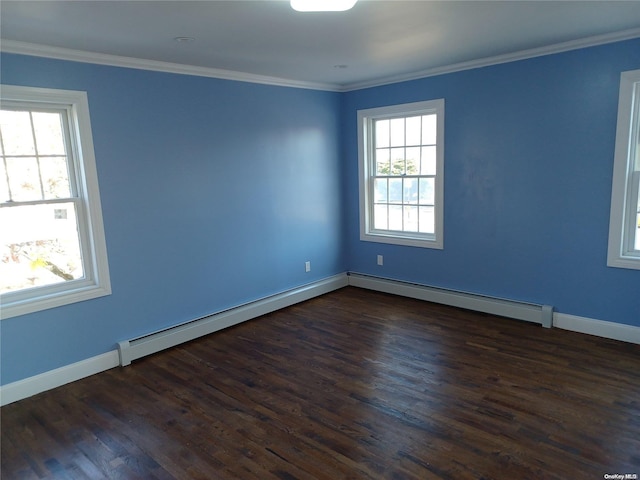 spare room featuring dark hardwood / wood-style flooring, a baseboard radiator, a wealth of natural light, and ornamental molding