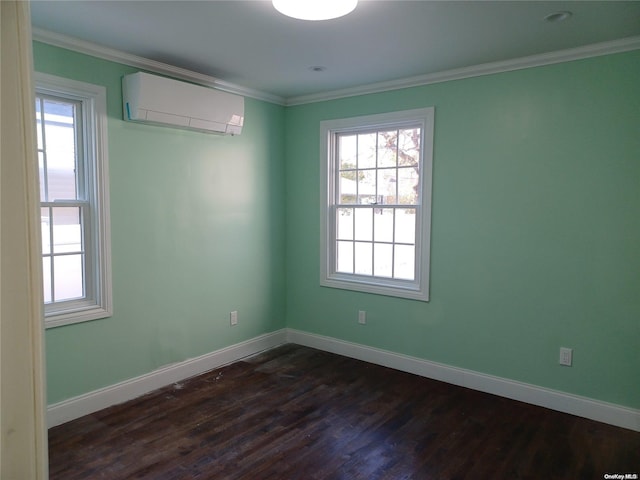 unfurnished room featuring a wall mounted air conditioner, dark hardwood / wood-style flooring, and ornamental molding