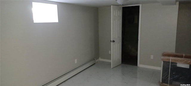 basement with a baseboard heating unit