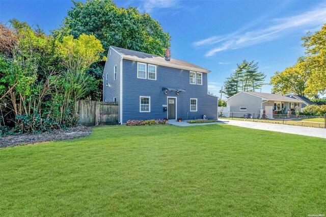 view of front of home with a front yard