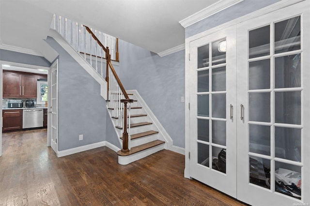 staircase with french doors, wood-type flooring, and ornamental molding