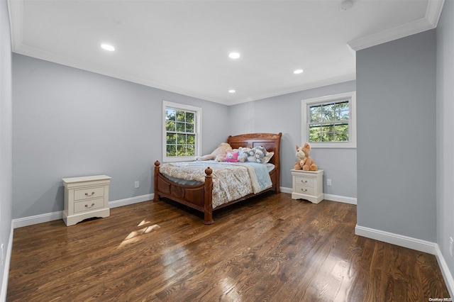 bedroom with dark hardwood / wood-style floors and crown molding