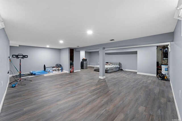 workout room with dark hardwood / wood-style floors