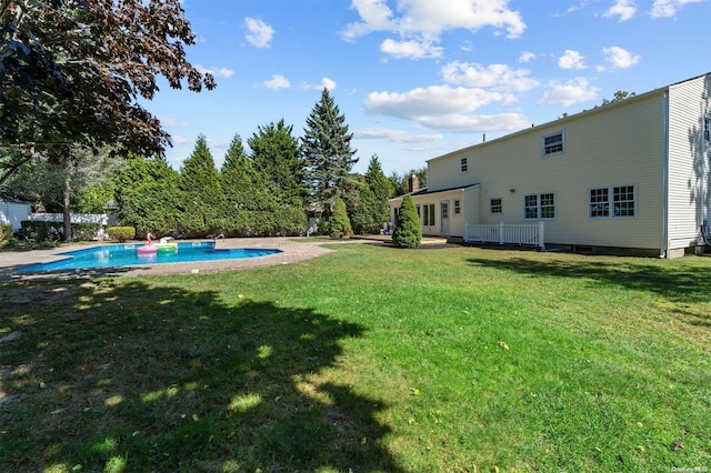 view of yard with a fenced in pool