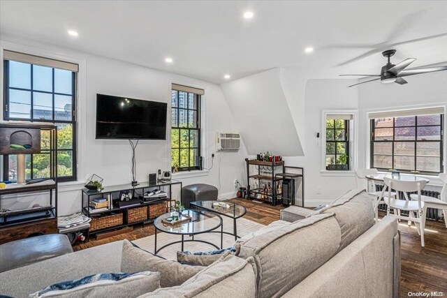 1 Station Sq Unit 315, Forest Hills, NY 11375 - living room with wood finished floors, a ceiling fan, recessed lighting, a wall mounted AC, and baseboards