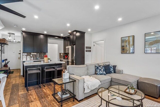 1 Station Sq Unit 315, Forest Hills, NY 11375 - living room featuring dark wood-type flooring and recessed lighting