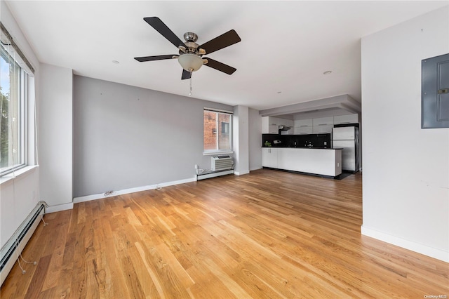 unfurnished living room featuring ceiling fan, a baseboard radiator, a wall mounted air conditioner, electric panel, and hardwood / wood-style floors