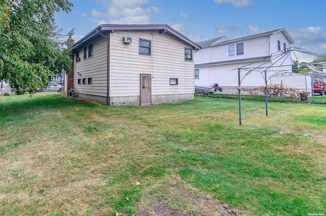 rear view of house with a lawn