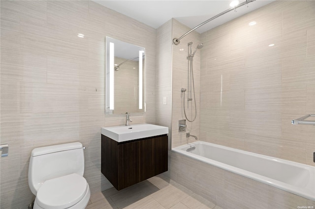 131-05 40th Rd Unit 10J, Flushing, NY 11354 - full bathroom featuring tiled shower / bath, tile walls, toilet, vanity, and tile patterned flooring