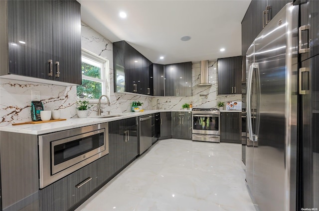 410 Church Ave, Woodmere, NY 11598 - kitchen with stainless steel appliances, wall chimney exhaust hood, backsplash, light marble finish flooring, and recessed lighting