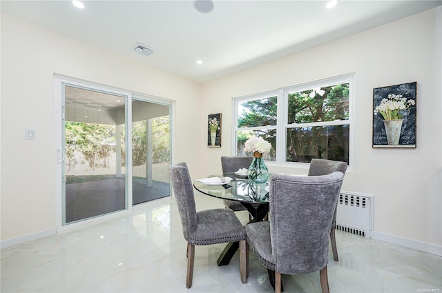 410 Church Ave, Woodmere, NY 11598 - dining room with light marble finish flooring, recessed lighting, and radiator heating unit
