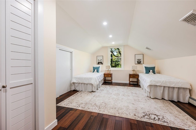 bedroom featuring dark hardwood / wood-style flooring and lofted ceiling