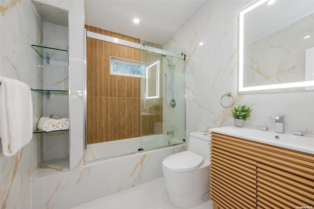 full bathroom with shower / bath combination with glass door, vanity, and toilet