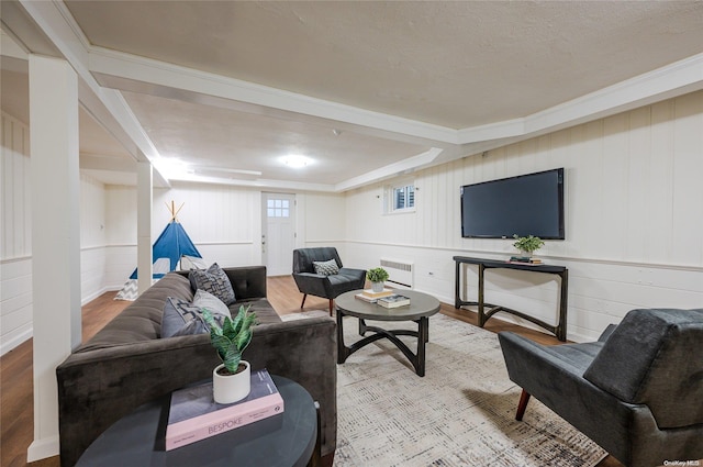 410 Church Ave, Woodmere, NY 11598 - living room with wood finished floors, radiator heating unit, and crown molding
