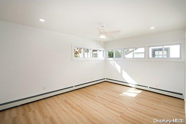 unfurnished room with light hardwood / wood-style floors and ceiling fan