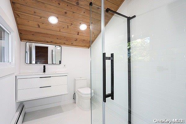 bathroom with toilet, baseboard heating, and wooden ceiling