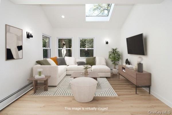 living room with light hardwood / wood-style floors, baseboard heating, a skylight, and high vaulted ceiling