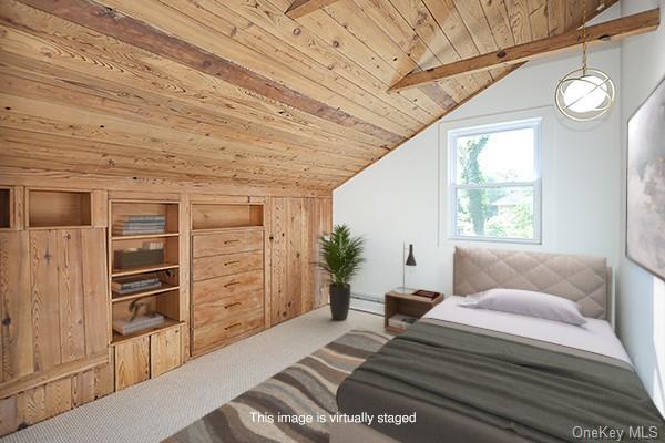 bedroom with wood ceiling, vaulted ceiling with beams, and carpet