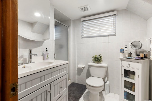 bathroom with walk in shower, tile walls, tile patterned flooring, toilet, and lofted ceiling