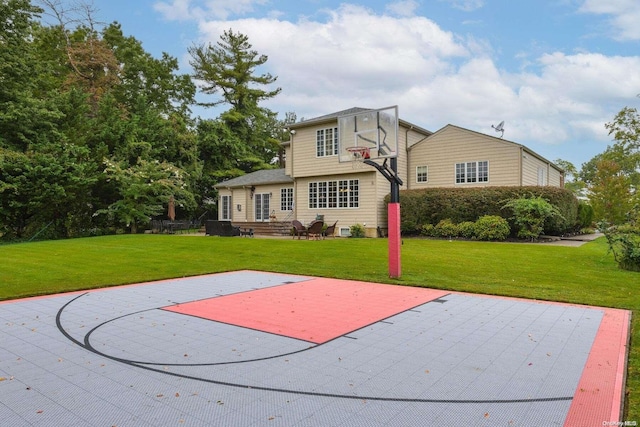 view of basketball court featuring a lawn