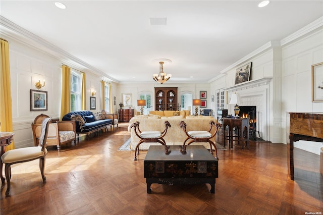 living room featuring crown molding, a notable chandelier, and parquet flooring