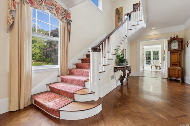 stairway with parquet flooring