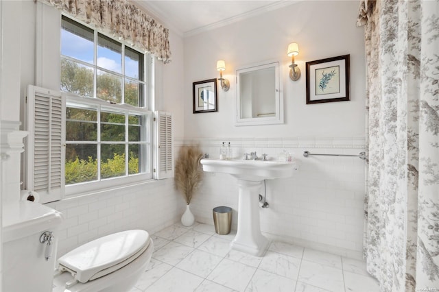 bathroom with toilet, a shower with shower curtain, tile walls, and ornamental molding