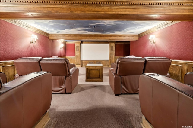 carpeted cinema room with beam ceiling and crown molding