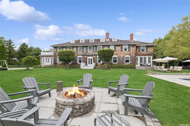 view of patio / terrace with an outdoor fire pit and french doors