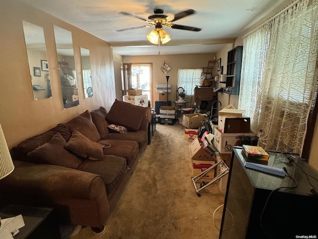 living room with carpet flooring and ceiling fan