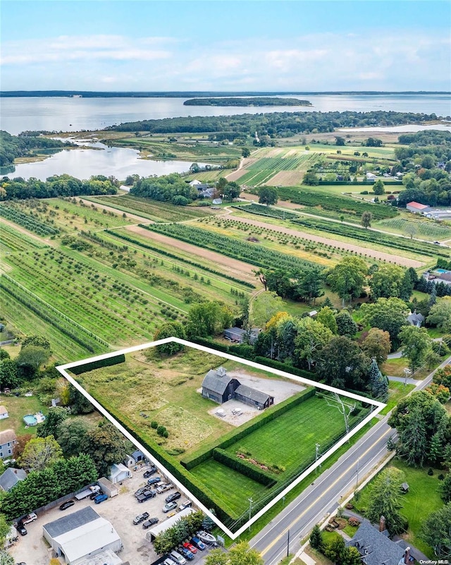 aerial view with a water view and a rural view