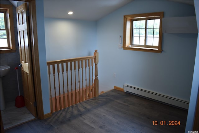 bonus room featuring dark hardwood / wood-style flooring, a baseboard radiator, and lofted ceiling