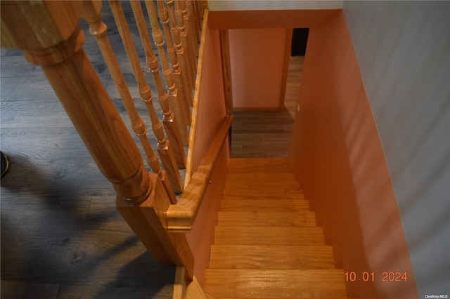 stairway with wood-type flooring