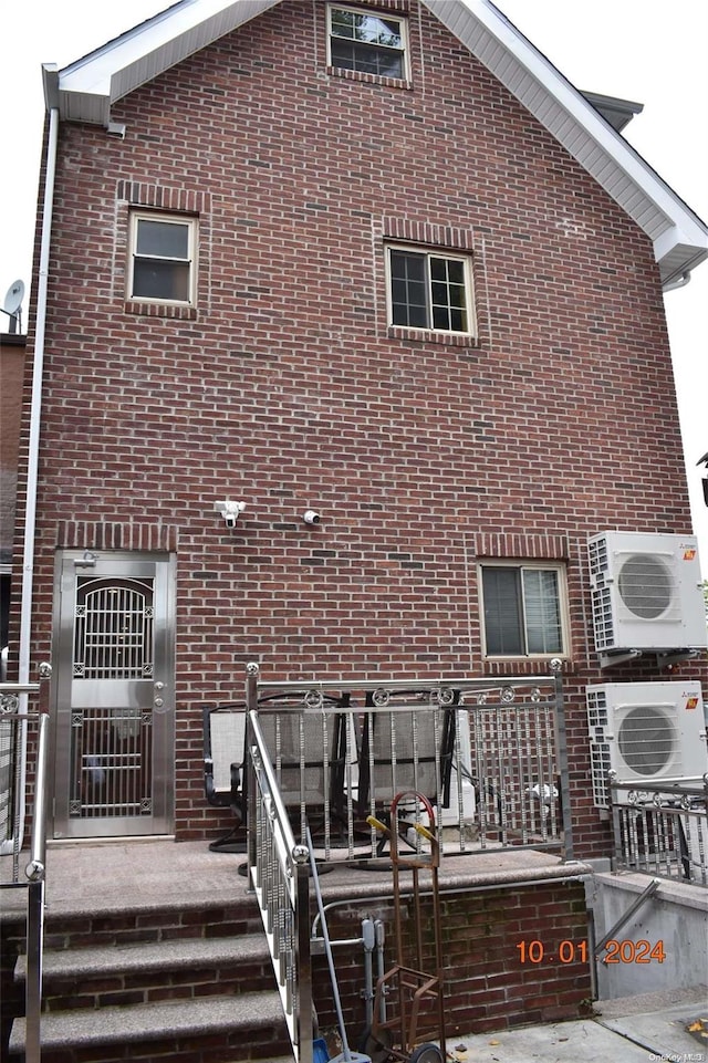 back of property featuring ac unit