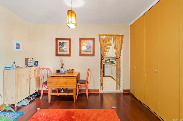 dining space featuring dark hardwood / wood-style floors