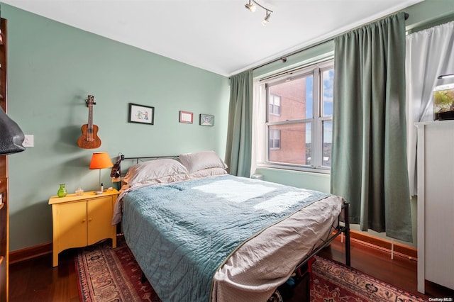 bedroom featuring dark wood-type flooring