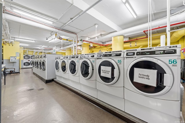 clothes washing area featuring washer and dryer