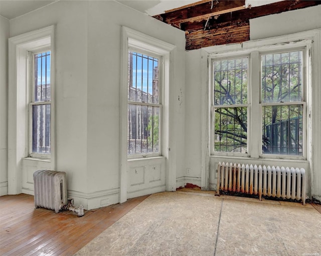 475 W 140th St, New York Manhattan, NY 10031 - spare room with radiator heating unit and healthy amount of natural light