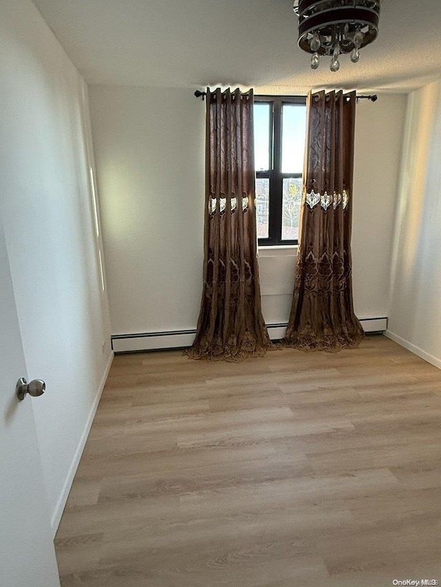 unfurnished room featuring light hardwood / wood-style floors