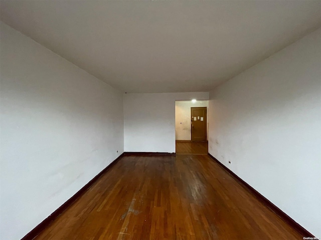 37-27 86th St Unit 4A, Jackson Heights, NY 11372 - spare room featuring wood finished floors and baseboards