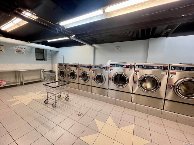 37-27 86th St Unit 4A, Jackson Heights, NY 11372 - shared laundry room with independent washer and dryer and tile patterned floors