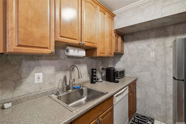 kitchen featuring sink, tasteful backsplash, stainless steel fridge, crown molding, and white dishwasher