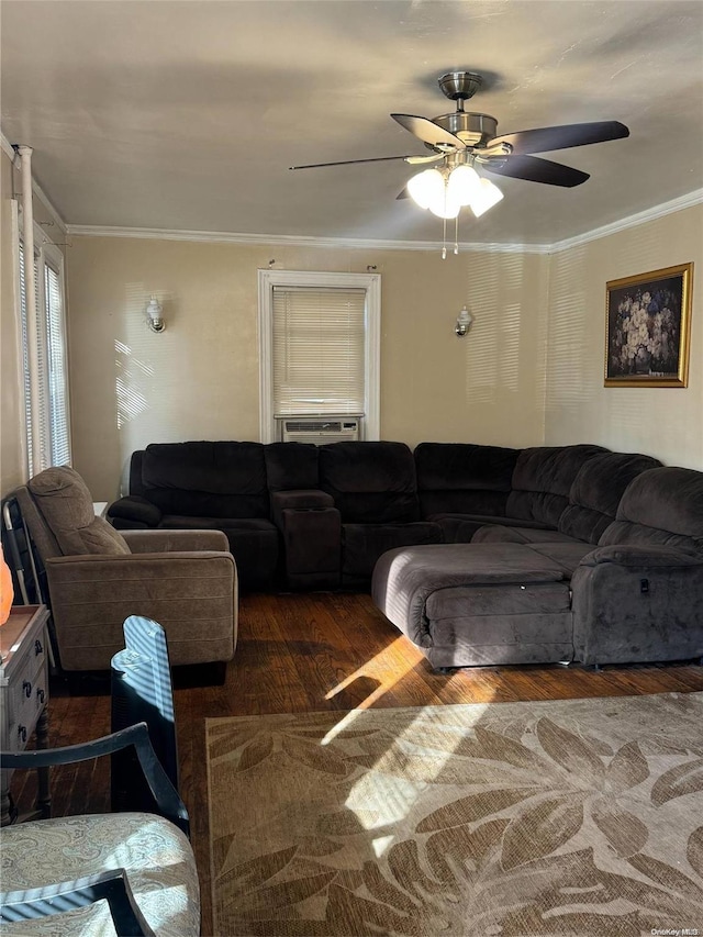 living room featuring ornamental molding, cooling unit, ceiling fan, and dark wood-type flooring