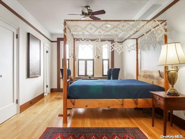 bedroom featuring hardwood / wood-style flooring and ceiling fan